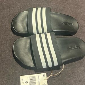 Black and white Adidas slides